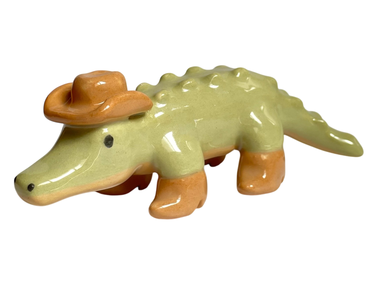 alligator statuette wearing a cowboy hat