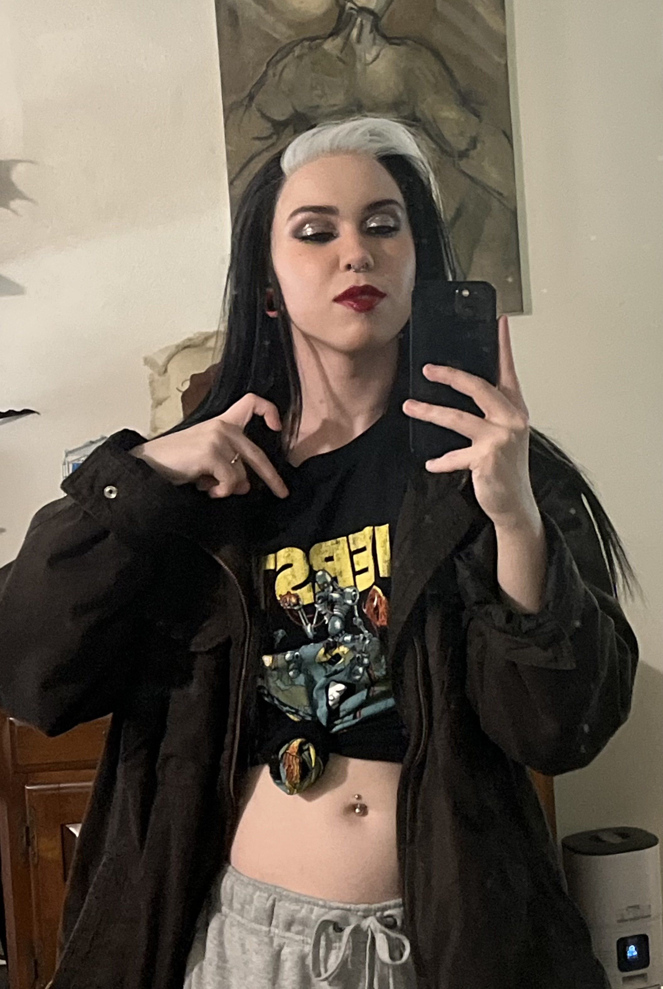 a selfie of bex with black and white hair and silver eyeshadow.